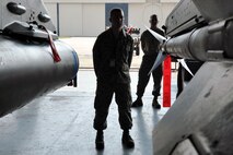 KUNSAN AIR BASE, Republic of Korea -- Senior Airman Ryan Castle, 8th Maintenance Operations Squadron load crew member evaluator, assesses a load crew from the 80th Aircraft Maintenance Squadron. Load crews are evaluated and have to qualify quarterly. (U.S. Air Force photo/Senior Airman Brittany Y. Bateman) 