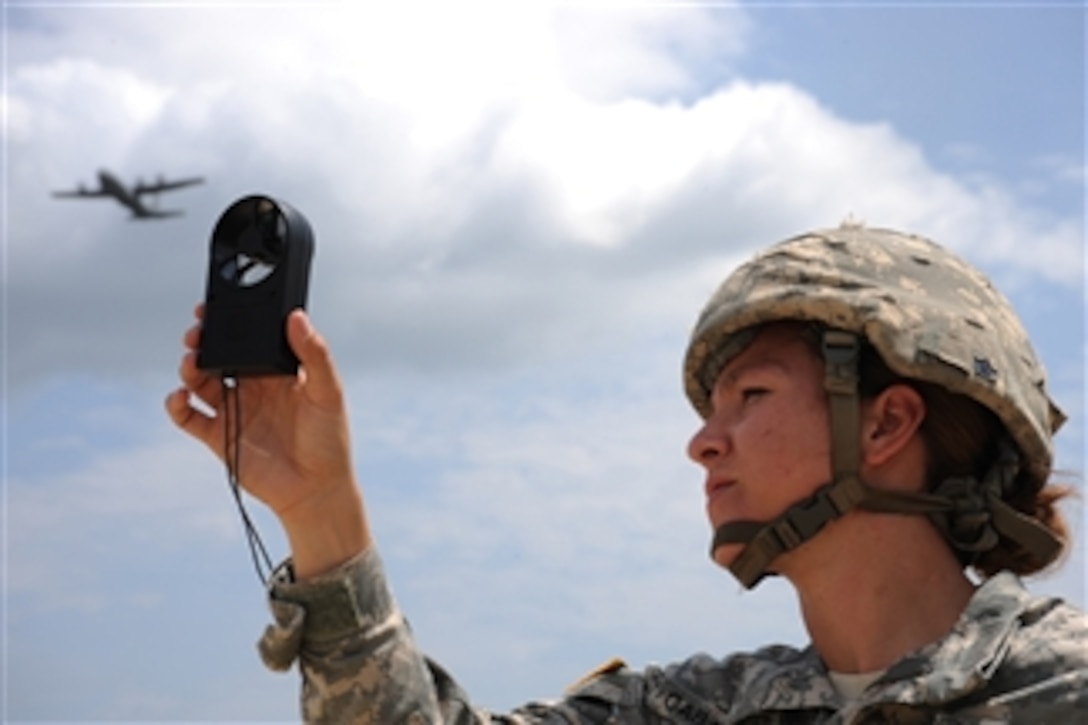 U.S. Army Sgt. Katilina Caballero, a drop zone safety team member assigned to 1st Battalion, Special Troops Battalion, checks wind speed prior to a heavy drop airlift mission during Joint Operations Access Exercise at Fort Bragg in Fayetteville, N.C., on June 23, 2011.  A joint operations access exercise is a two-week exercise to prepare Air Force and Army service members to respond to worldwide crisis and contingencies.  