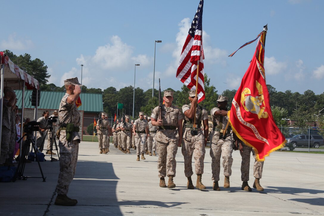 Lt. Col. Paul A. Rosenbloom, left,  salutes the national ensign during the pass and review, which marked the end of Marine Wing Support Squadron 271’s change of command ceremony outside the squadron’s engineer facility June 30. Lt. Col. Paul D. Baker relinquished command of MWSS-271 to Rosenbloom.