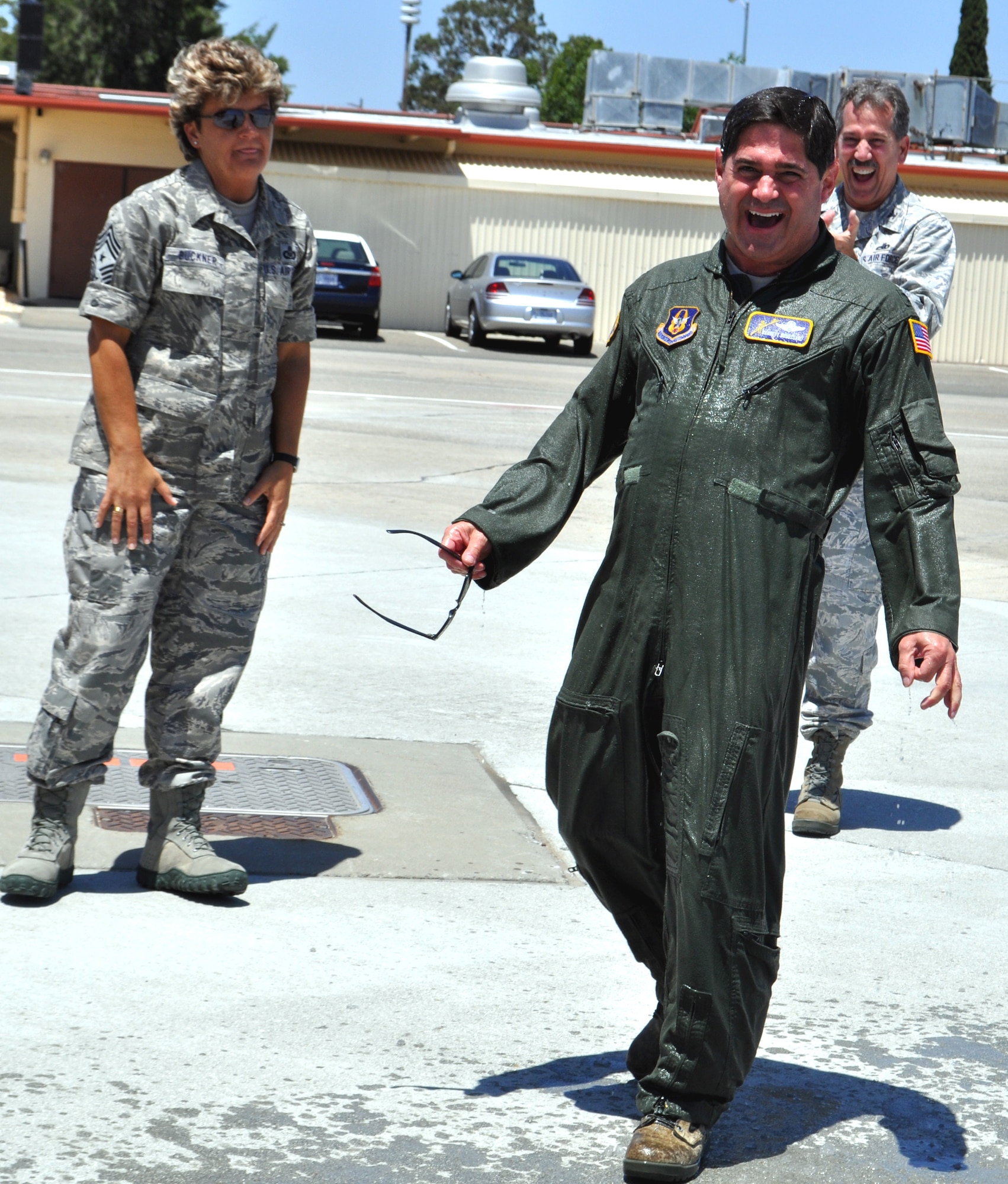 TRAVIS AIR FORCE BASE, Calif. -- Col. Barrett Broussard laughs after his traditional "hosing down" following his fini flight June 24, 2011. (U.S. Air Force photo/Senior Master Sgt. Ellen L. Hatfield)