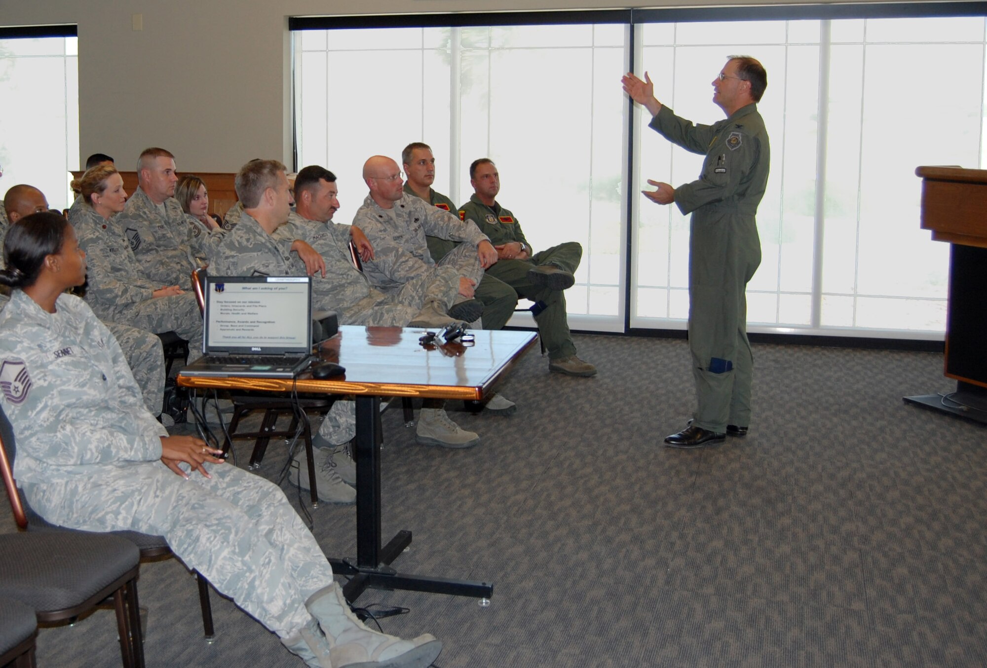 NELLIS AIR FORCE BASE, Nev. -- (Right) Col. Herman Brunke, Jr., 926th Group commander, briefs group personnel on the status of the unit and the way ahead during a commander's call here June 29. (U.S. Air Force photo/Capt. Jessica Martin)