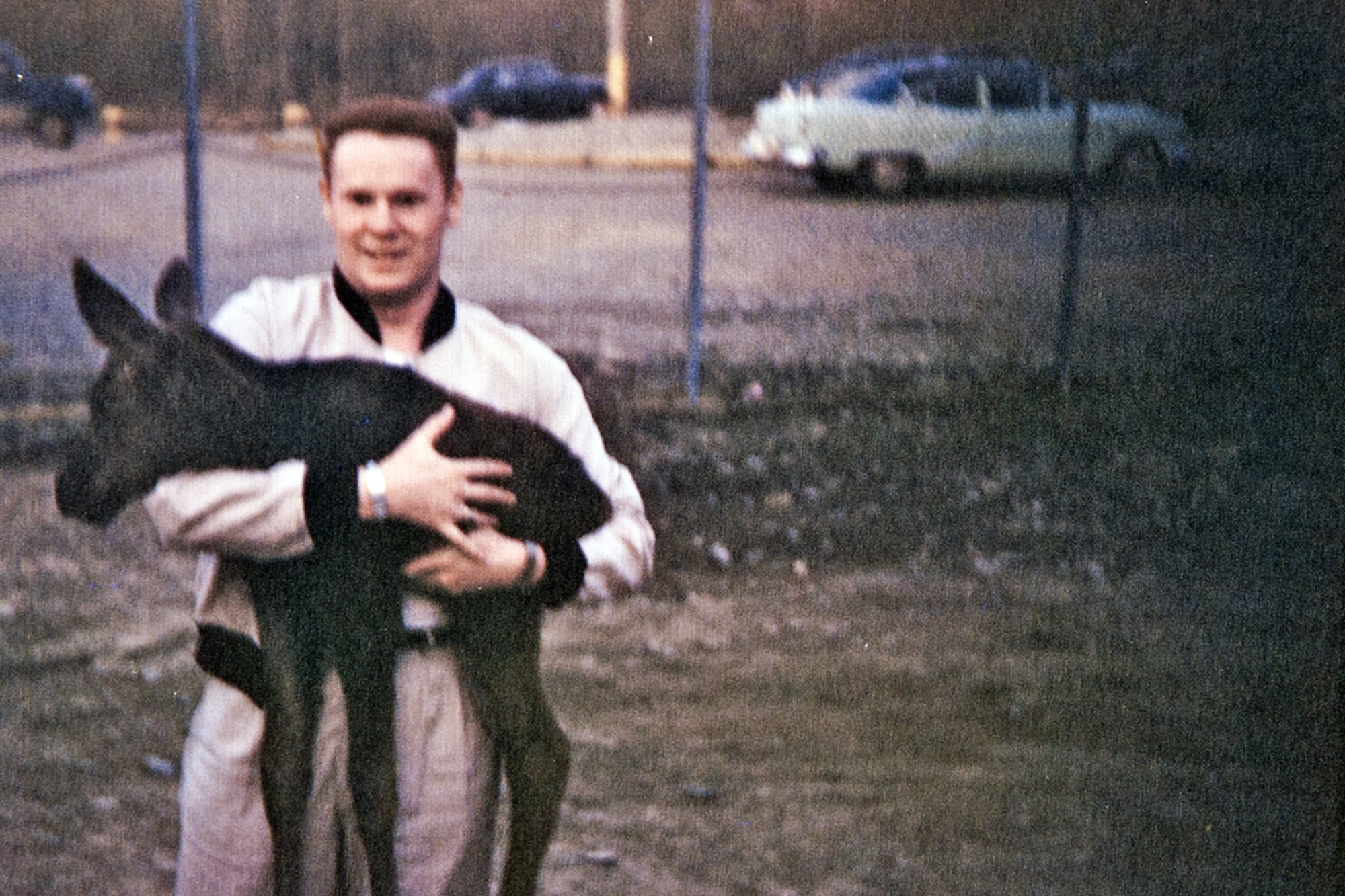 Airman 2nd Class Forrest St. Aubin holds a female moose calf during his time at
Elmendorf Air Force Base in the early 1950s. The calf was found orphaned behind the
squadron headquarters building, and Airmen of the 3rd Radio Squadron Mobile fed it from their own rations for the spring and summer, and released it back into the wild that fall, St. Aubin said. (Photo courtesy Forrest St. Aubin)