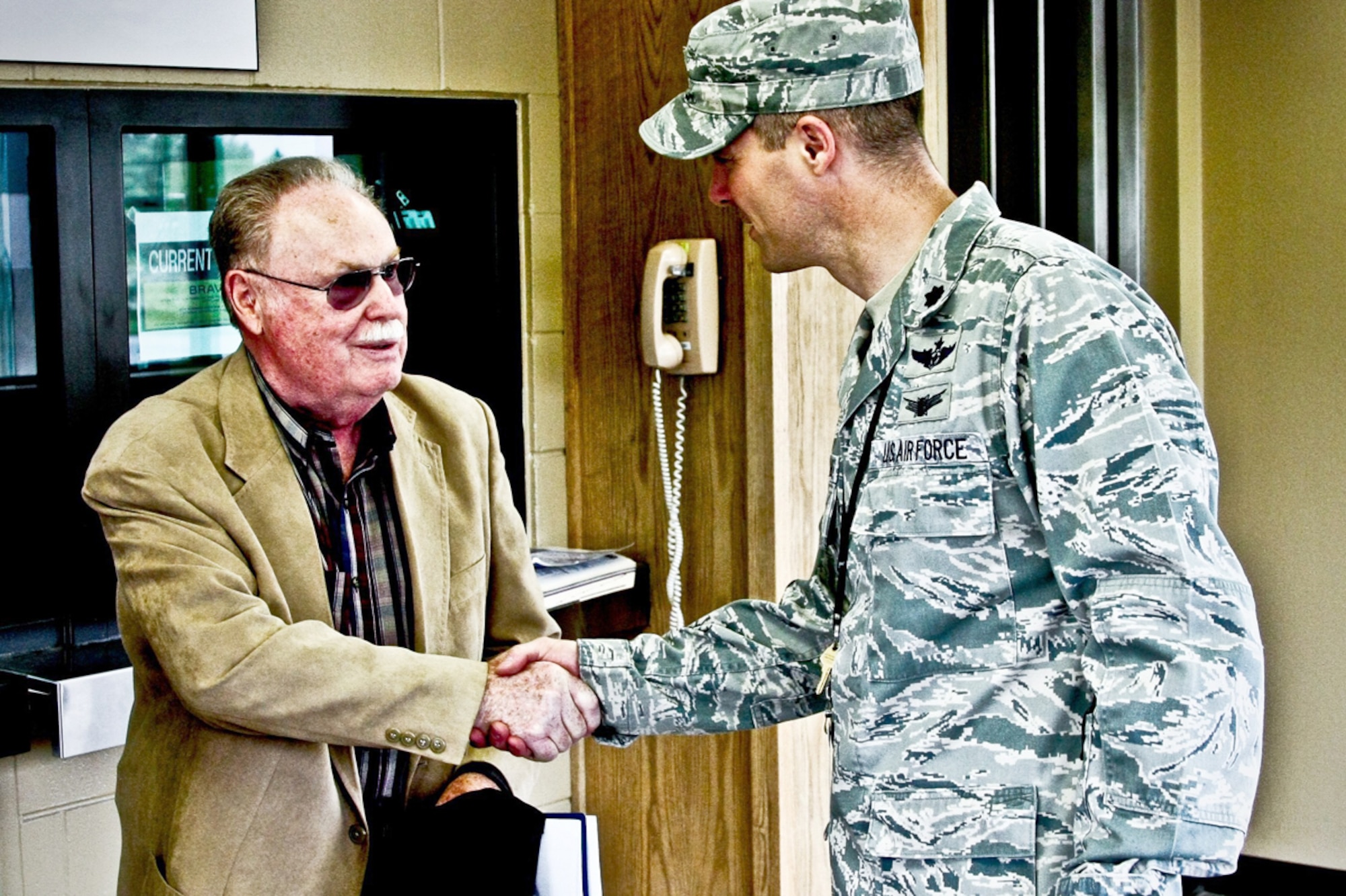 Lt. Col. Augustin “Pete” Briguet presents a 381st Intelligence Squadron challenge
coin to former Airman 2nd Class Forrest St. Aubin in early June at the squadron headquarters. St. Aubin was stationed at then-Elmendorf Air Force Base from 1953 until 1955, when he served with the 3rd Radio Squadron Mobile as a Russian linguist. He regaled current unit members with stories of his time on what is now Joint Base Elmendorf-Richardson. (U.S. Air Force photo\TSgt. Aaron Dalton/381st IS)