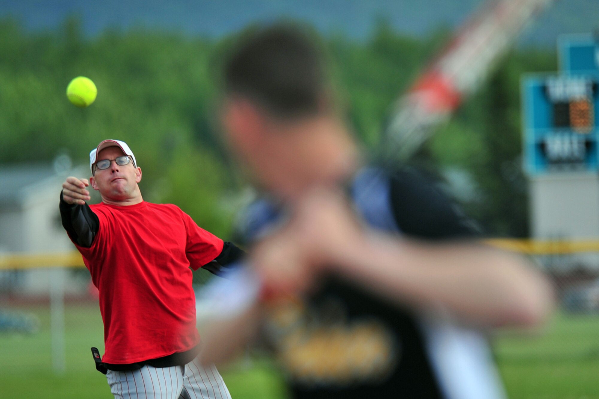 JOINT BASE ELMENDORF-RICHARDSON, Alaska???1st Sgt. Al Mariner, 425th Brigade Special Troops Battalion, pitches to Sgt. Brian Carter,  B Company 3rd Battalion (Airborne) 509th Infantry Regiment, during a intramural softball game between B Company 3rd Battalion (Airborne) 509th Infantry Regiment and 425th Brigade Special Troops Battalion at Joint Base Elmendorf-Richardson, Wednesday, June 22, 2011.  (U.S. Air Force photo/JBER POA, Justin Connaher)