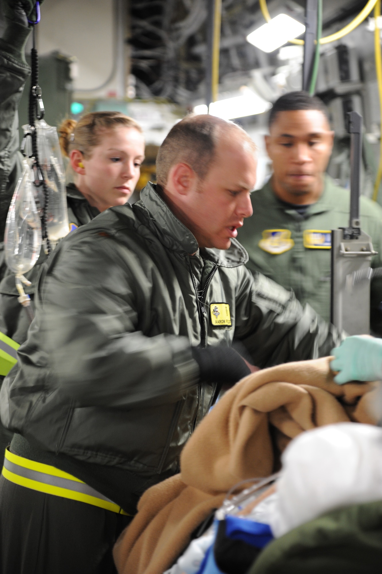 CHRISTCHURCH, New Zealand – Maj. (Dr.) Aaron Fields, Critical Care Air Transport Team leader, and Maj. Alane Garlisi, 18th Aeromedical Evacuation Sqaudron detachment commander, prepare to off-load a National Science Foundation contractor aboard a C-17 Globemaster III, following a medical evacuation mission from McMurdo Station Antarctica, June 30. Active Duty, Guard and Reserve Airmen attached to this mission, which originated at Joint Base Lewis-McChord and staged out of Christchurch, assembled the full range of medical and support capabilities to safely evacuate the patient. The team faced variables such as local tremors, volcanic ash and severe weather condition in Antarctica. (U.S. Air Force photo/Capt. David Herndon)