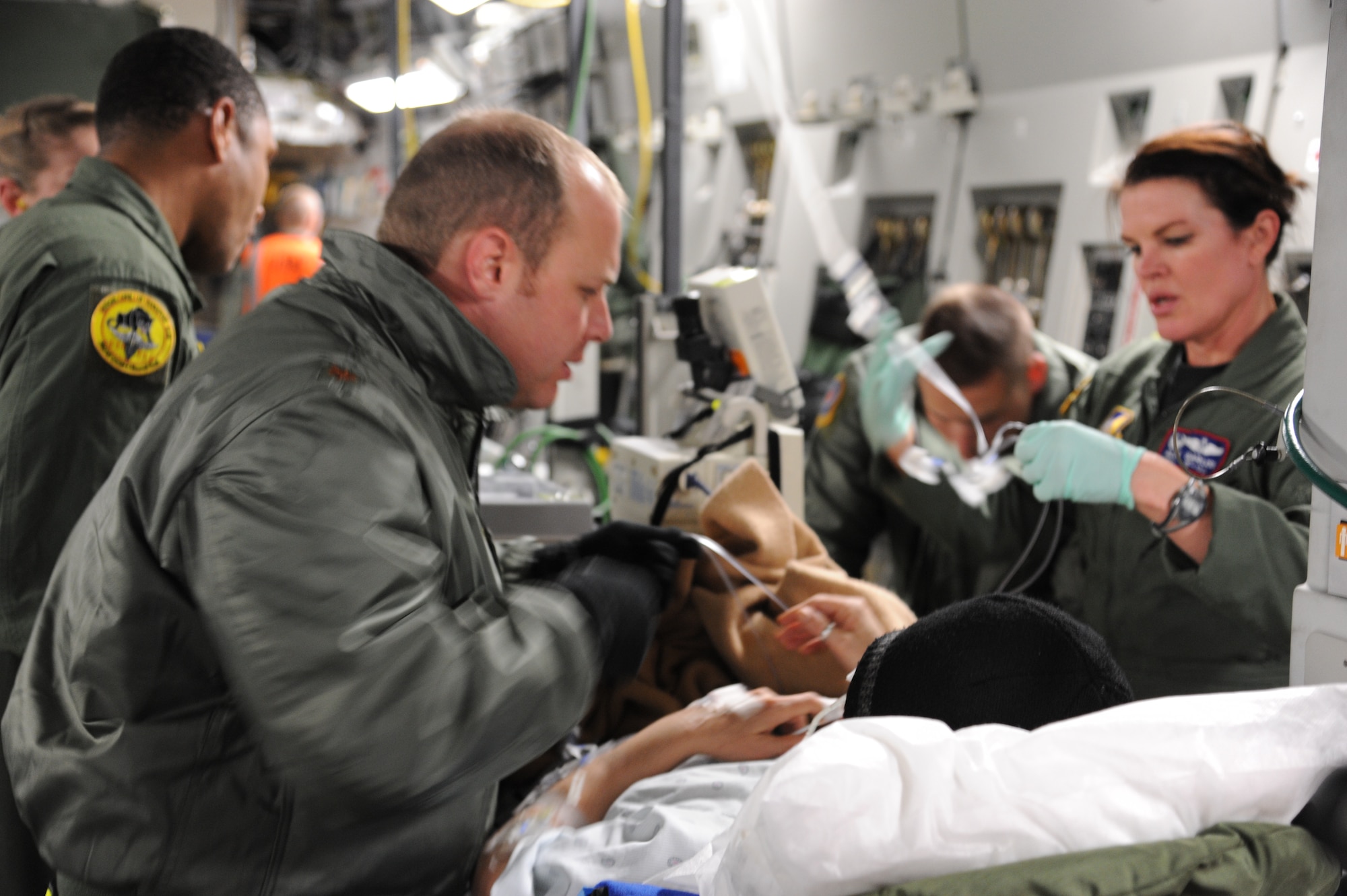 CHRISTCHURCH, New Zealand – Maj. (Dr.) Aaron Fields, Critical Care Air Transport Team leader, and Maj. Alane Garlisi, 18th Aeromedical Evacuation Sqaudron detachment commander, prepare to off-load a National Science Foundation contractor aboard a C-17 Globemaster III, following a medical evacuation mission from McMurdo Station Antarctica, June 30. Active Duty, Guard and Reserve Airmen attached to this mission, which originated at Joint Base Lewis-McChord and staged out of Christchurch, assembled the full range of medical and support capabilities to safely evacuate the patient. The team faced variables such as local tremors, volcanic ash and severe weather condition in Antarctica. (U.S. Air Force photo/Capt. David Herndon)