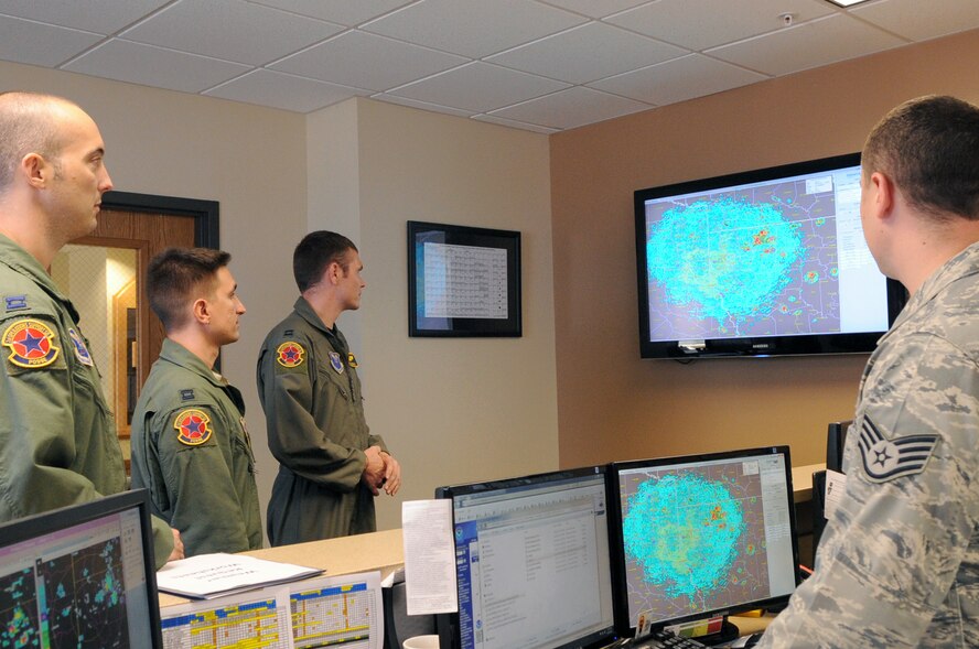 Staff Sgt. Larry Woodson, 2nd Operational Support Squadron weather forecaster, briefs aircrew on Barksdale Air Force Base, La., June 30. The mission execution forecast briefing is briefed to all aircrews before take-off. (U.S. Air Force photo/Senior Airman La’Shanette V. Garrett)(RELEASED)