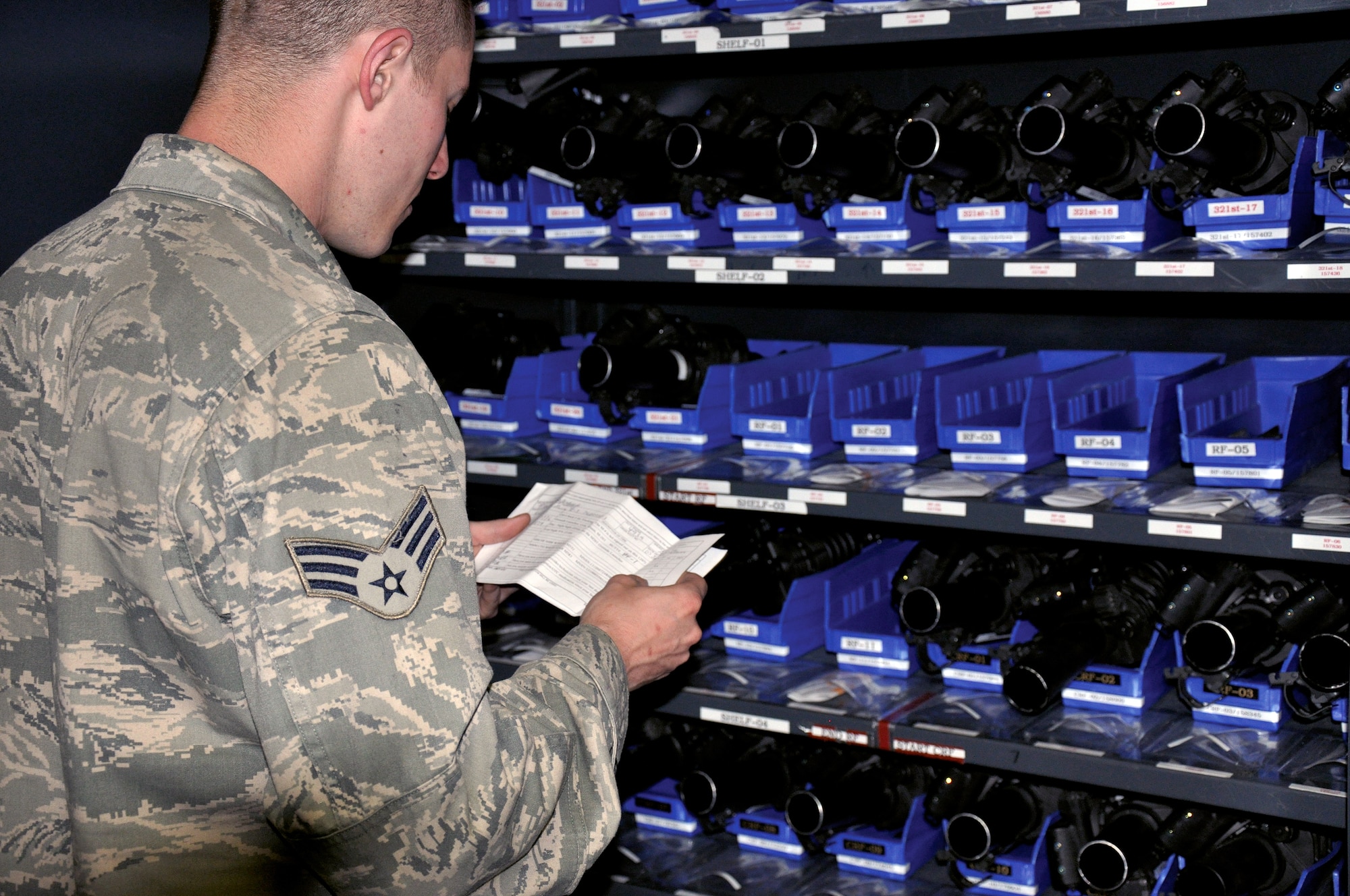 Senior Airman Brett Ficek, 90th Security Support Squadron armory technician, validates equipment issued during a mid-shift accountability check during a recent exercise. Armory technicians accomplish accountability checks five times per shift. (U.S. Air Force photo by Staff Sgt. Mike Tryon)