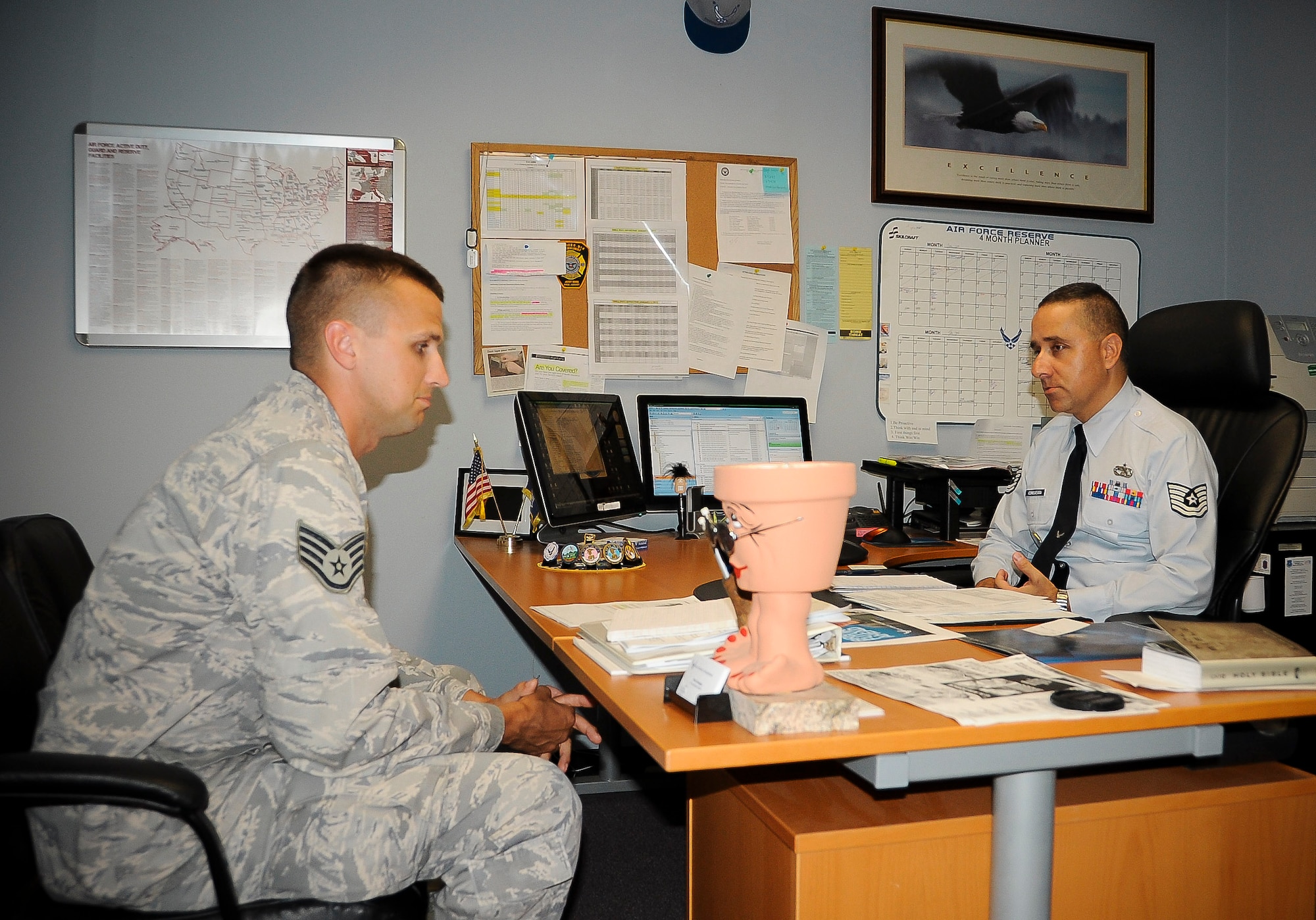 Tech. Sgt. Pedro Consuegra, 514th Force Support Squadron recruiter, speaks with an Airman about the Palace Chase and Front programs. Consuegra is the main Air Force Reserve recruiter for the Joint Base McGuire-Dix-Lakehurst Airmen. (U.S. Air Force photo by Airman 1st Class Dennis Sloan/Released)
