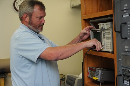 Dennis Bernsteen, 902nd Communications Squadron airfield systems maintenance technician, prepares test bequipment needed to performe maintenance on the tactical air navigation system on Randolph Air Force Base June 23, 2011.  Airfied systems maintenance technicians ensure all airfield systems operate to specifications. (U.S. Air Force photo/Rich McFadden) (released)