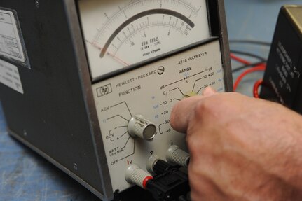 Robert Cantu, 902nd Communications Squadron airfield systems maintenance technician, prepares test equipment needed to perform maintenance on a ground to air radio at Randolph Air Force Base June 23. Airfield systems maintenance technicians ensure all airfield systems operate to specifications. (U.S. Air Force photo/Rich McFadden) (released)