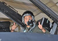 U.S. Air Force Academy Cadet Cody Hanson gives a thumbs up from an F-16 Fighting Falcon June 23. Cadet Hanson received an incentive flight while participating in Operation Air Force at Lackland to experience, firsthand, everything an operational Air Force base has to offer. (U.S. Air Force photo/Alan Boedeker)