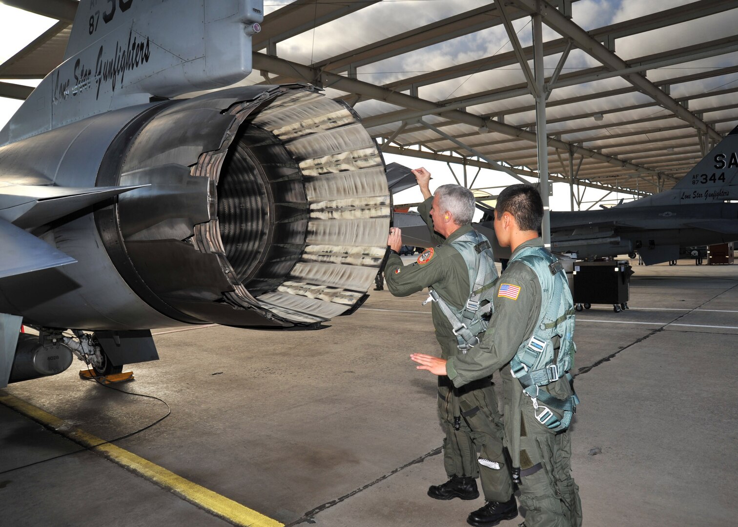 Col. Michael Kelley, 182nd Fighter Squadron, and U.S. Air Force Academy Cadet Cody Hanson, perform a pre-flight inspection on an F-16 Fighting Falcon June 23. Cadet Hanson received an incentive flight while participating in Operation Air Force at Lackland to experience, firsthand, everything an operational Air Force base has to offer. (U.S. Air Force photo/Alan Boedeker)