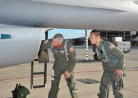 Col. Michael Kelley, 182nd Fighter Squadron, and U.S. Air Force Academy Cadet Cody Hanson, perform a pre-flight inspection on an F-16 Fighting Falcon June 23. Cadet Hanson received an incentive flight while participating in Operation Air Force at Lackland to experience, firsthand, everything an operational Air Force base has to offer. (U.S. Air Force photo/Alan Boedeker)