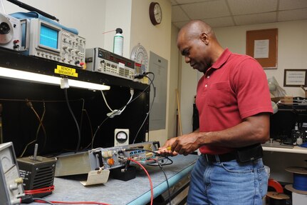 Rene Allanby, 902nd Communications Squadron airfield systems maintenance technician, performs maintenance on a ground to air radio at Randolph Air Force Base June 23. Airfield systems maintenance technicians ensure all airfield systems operate to specifications. (U.S. Air Force photo/Rich McFadden) (released)
