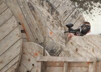Staff Sgt. Jonathan Traynor is searching for his next target. Sergeant Traynor and 20 of his friends reserved a day of paintball fun at the Lackland Outdoor Recreation Center June 23. (U.S. Air Force photo/Robbin Cresswell)