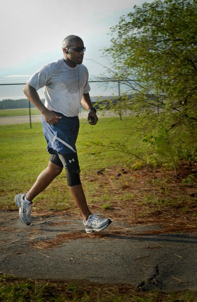 U.S. Air Force Tech. Sgt. Ariesus Preston, 336th Recruiting Squadron member, jogs along a trail at Moody Air Force Base, Ga., June 28, 2011. Jogging provides a great cardiovascular workout and also strengthens and tones your muscles. (U.S. Air Force photo by Airman 1st Class Douglas Ellis/Released) 