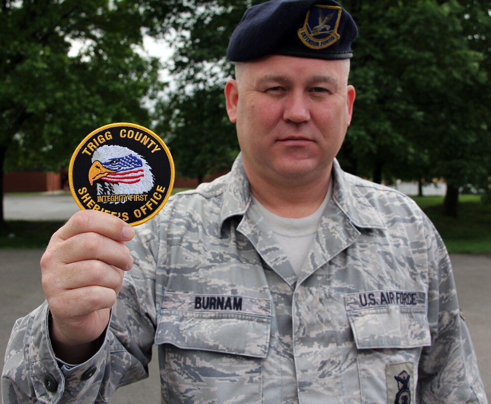 Air Force Reserve Master Sgt. Leslie Burnam knows military and civilian law enforcement.  He has been a long-time member of the 932nd Security Forces Squadron and is the Sheriff of Trigg County, Kentucky.  Sadly, June was  Sergeant Burnam's  last monthly unit drill.  He decided to retire, because of his expanding duties as county sheriff.  Sergeant Burnam proudly served his country for 23 years.  
His parting words were for the young Airmen.  "Take advantage of the training and opportunities the Reserve offers.. You'll reap benefits down the road."  (U.S. Air Force photo/Maj. Stan Paregien) 