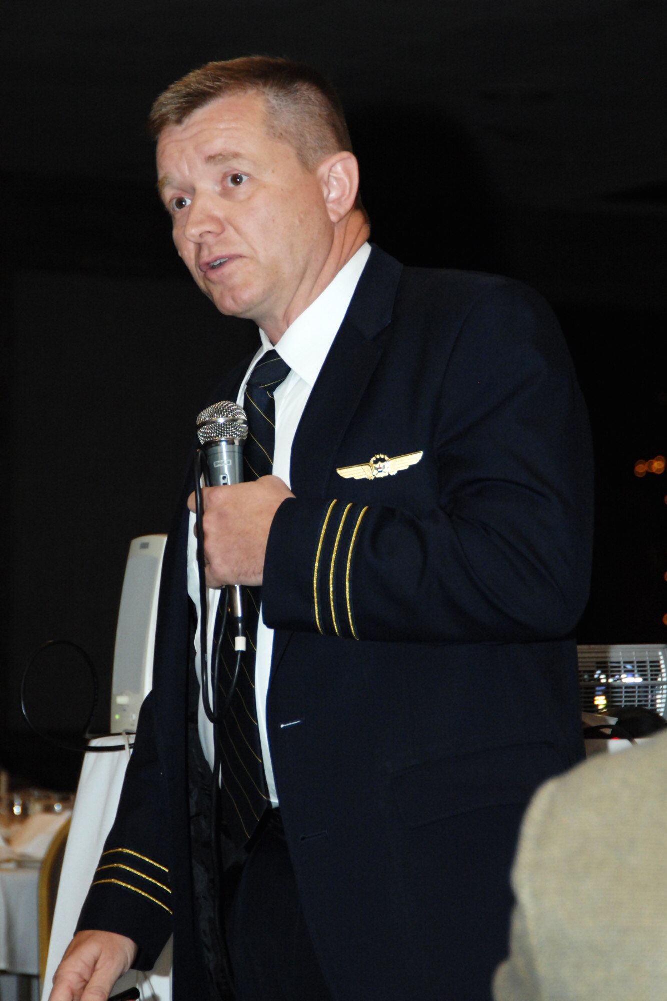 Michigan Air National Guard Lt, Col. Rolf Mammen wears his United Airlines pilot uniform as he recalls the events of Sept. 11, 2001, during a meeting of the Selfridge Base Community Council near Selfridge Air National Guard Base, June 21, 2001. Mammen, who is also a pilot with the 127th Wing, was flying in a United airliner, bound for New York, on the morning of Sept. 11. (USAF photo by Rachel Barton, 127th Wing Public Affairs)