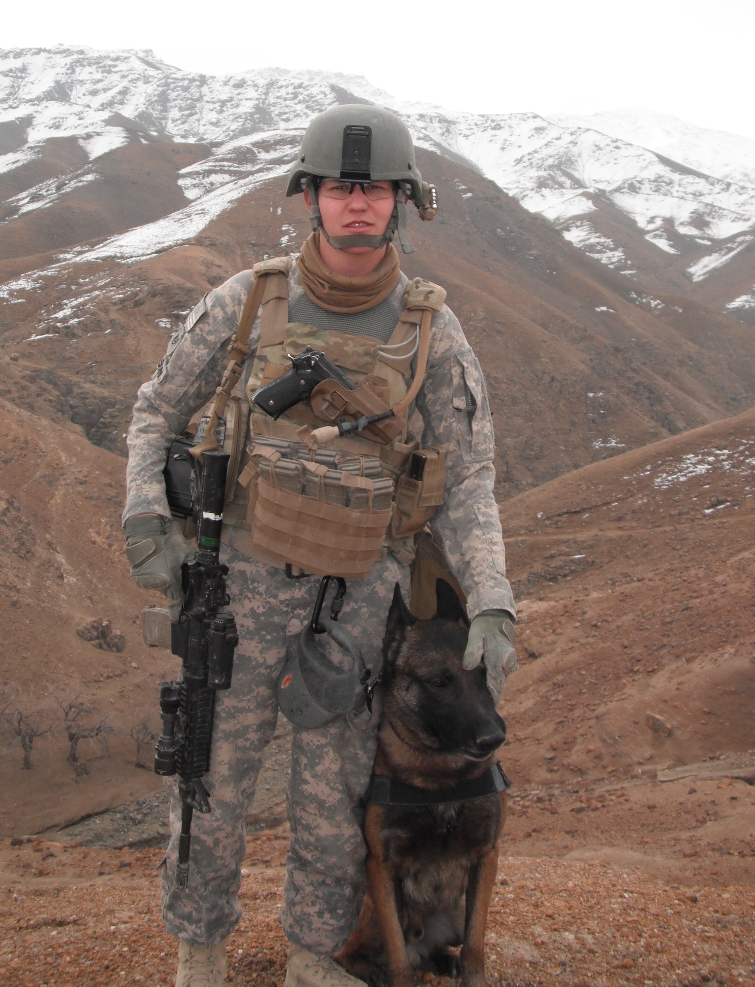LAUGHLIN AIR FORCE BASE, Texas – Staff Sgt. Britney Simpson, 47th Security Forces Squadron Military Working Dog handler, poses with her partner, XXavier, during a recent deployment to Afghanistan. Sergeant Simpson was awarded numerous medals for her accomplishments in the area of responsibility. (Contributed photo)