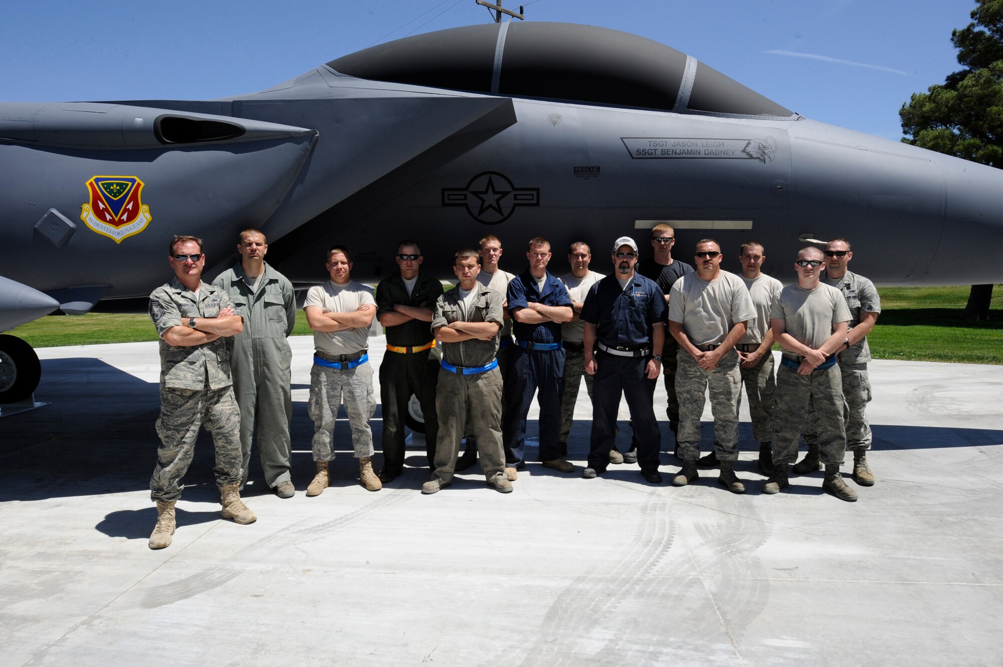 MOUNTAIN HOME AIR FORCE BASE, Idaho – The group that completed the final installation process of the new F-15E Strike Eagle static display stand together at the corner of Gunfighter Ave. and Aardvark Ave. after completing more than seven hours of work here June 25. The crew chose to stand below the name of their fellow Airman, Tech. Sgt. Jason Leigh, a former 366th Equipment Maintenance Squadron member who was killed April 2010 in a motorcycle accident while on a TDY in Las Vegas, Nev. (U.S. Air Force photo by Senior Airman Angelina Drake) 