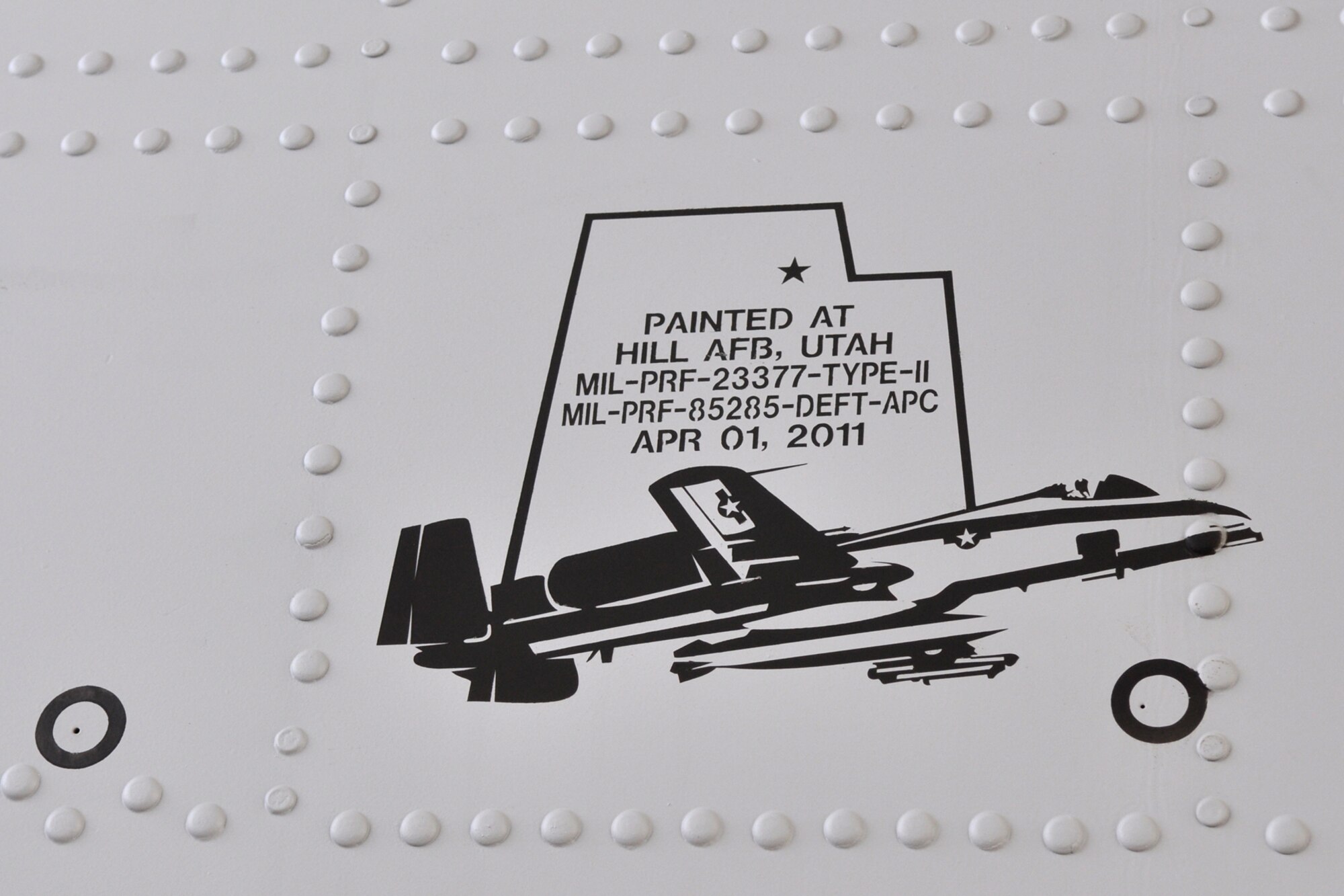 As an artist would sign a personal master piece, workers at the maintenance depot at Hill Air Force Base, Utah, leave their mark on an A-10 Thunderbolt II after completing repairs and modifications on the jet. The jet was at Hill AFB for precision engagement modifications and the replacement of a wing. (U.S. Air Force photo/Tech. Sgt. Jeff Walston)

