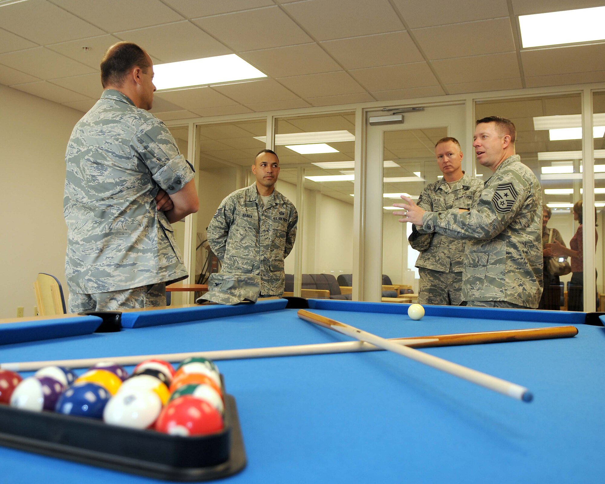GOODFELLOW AIR FORCE BASE, Texas – (From left) Col. Mark Damiano, 17th Training Wing Commander, Tech Sgt. Carlos Araiza, 17th Civil Engineer Squadron Airman facilities manager, Chief Master Sgt.  Quinton Otto, 17th Mission Support Group Superintendent, and Chief Master Sgt. Brendan Criswell, 17th TRW Command Chief, tour one of the dayrooms in a new 200-room dormitory. The dorm will house 400 Airmen training here. (U.S. Air Force photo/Staff Sgt. Heather L. Rodgers)
