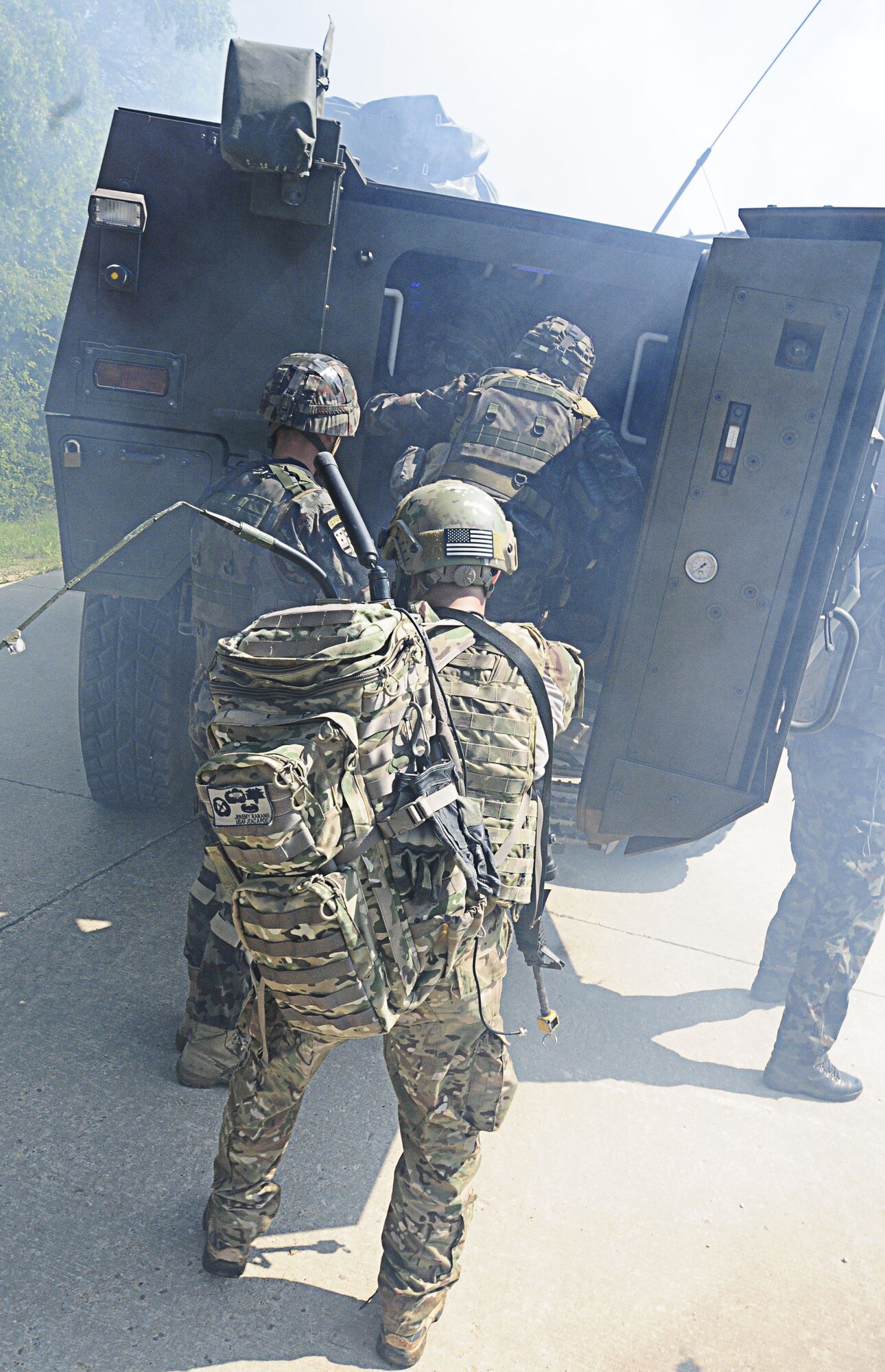 U.S. and NATO servicemembers evacuate a town after a successful search and rescue scenario at the Urban Lane, held at Hohenfels Training Area, Germany, June 27, 2011. The lane, which is run by Danish JTACs, is designed to train JTACs on operating in an urban environment. Allied Strike is Europe’s premier Close Air Support exercise, held annually to conduct robust, realistic CAS training that helps build partnership capacity among Allied NATO nations and refine the latest operational CAS tactics. (U.S. Air Force photo by Airman 1st Class Desiree W. Esposito)