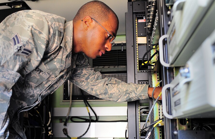 SHAW AIR FORCE BASE, S.C. -- Airman 1st Class Quinton Pope, 682nd Air Support Operations Squadron communication systems networking technician, ensures signal connection inside of a truck here June 28, 2011. Airman Pope is the Warrior of the Week for June 27 through July 1. (U.S. Air Force photo/ Airman 1st Class Daniel Phelps)