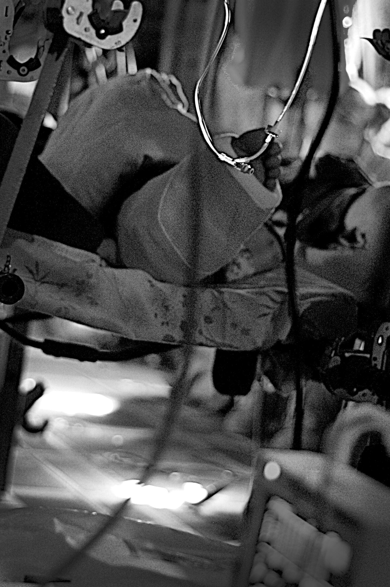 Litter patients await arrival to Bagram Airfield, Afghanistan, June 28, 2011, during an aeromedical evacuation flight. (U.S. Air Force photo illustration by Senior Airman Krista Rose)
