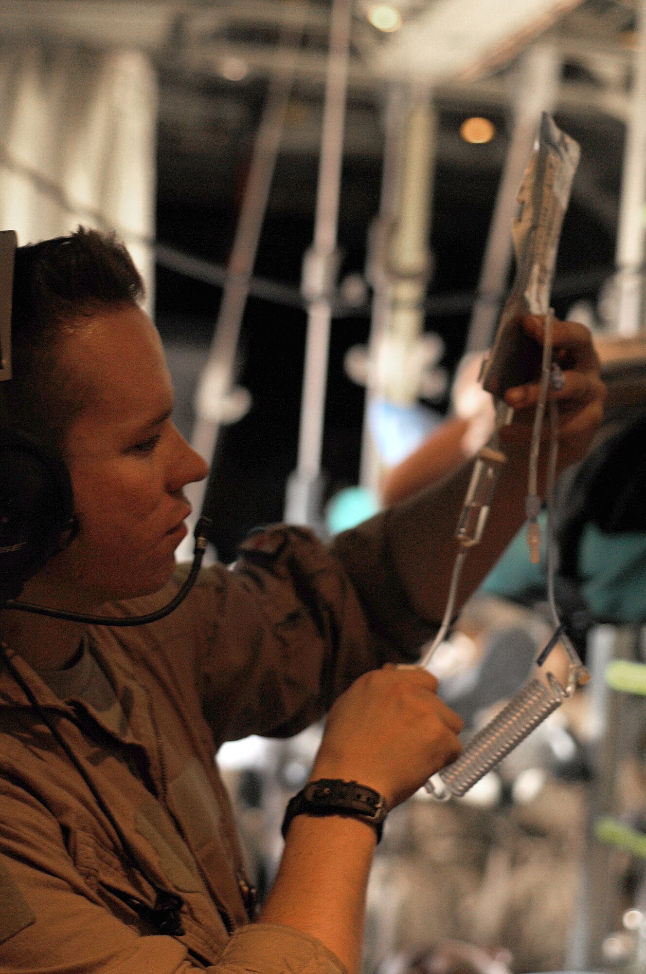 Staff Sgt. Jason Crewson, 455th Expeditionary Aeromedical Evacuation Flight 2nd medical technician, prepares patient medication while transporting patients to Bagram Airfield, Afghanistan, June 28, 2011. (U.S. Air Force photo by Senior Airman Krista Rose)