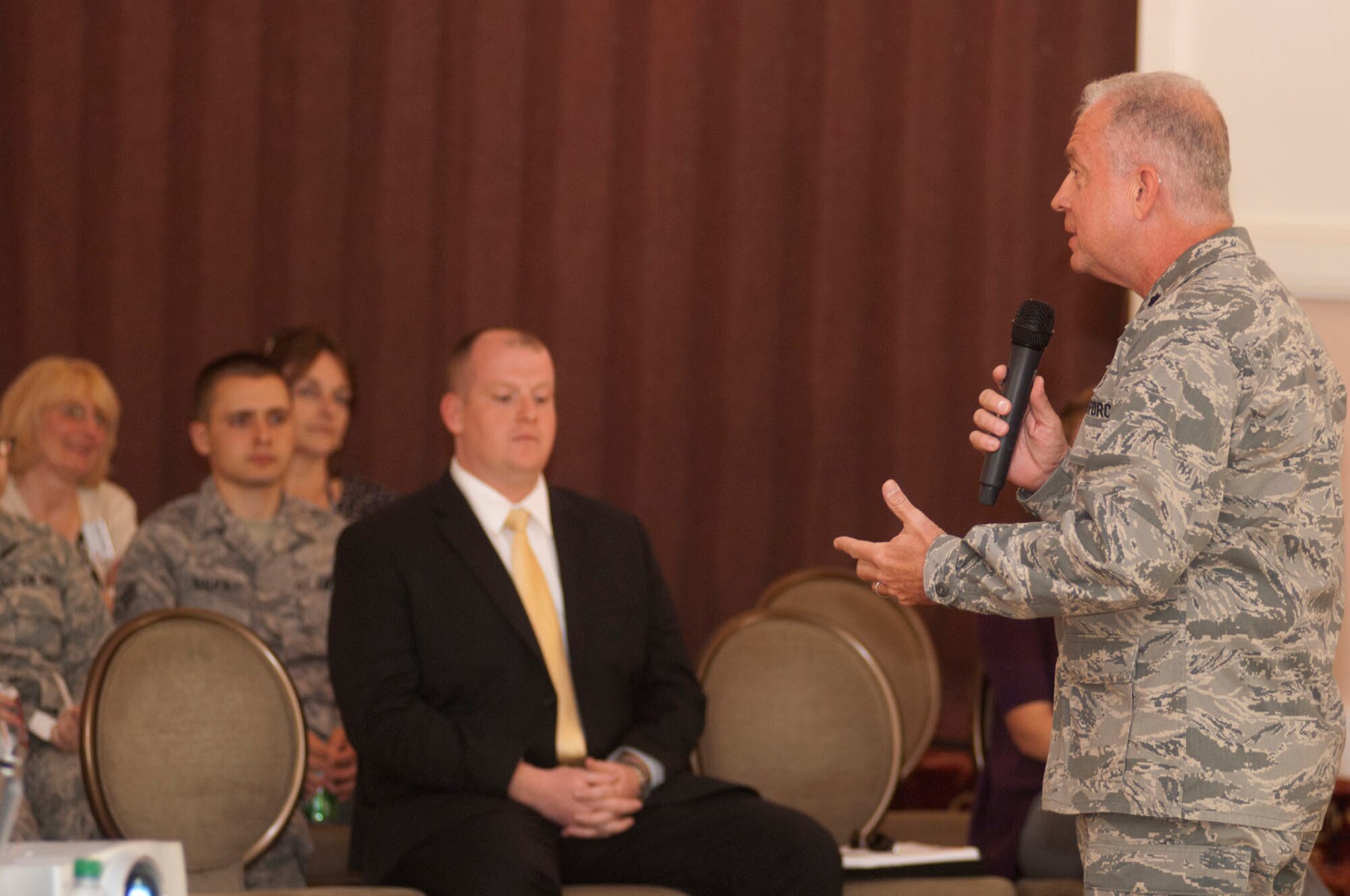 HANSCOM AIR FORCE BASE, Mass. – Chaplain Sam Rorer talks about the Base Chapel’s upcoming Vacation Bible School during the Town Hall meeting in the Minuteman Club ballroom June 28. In addition to base organizations presenting information about upcoming projects, activities and events, attendees were encouraged to ask questions or give comments on ways to make Hanscom a better place to live, work and play. (U.S. Air Force photo by Mark Wyatt)