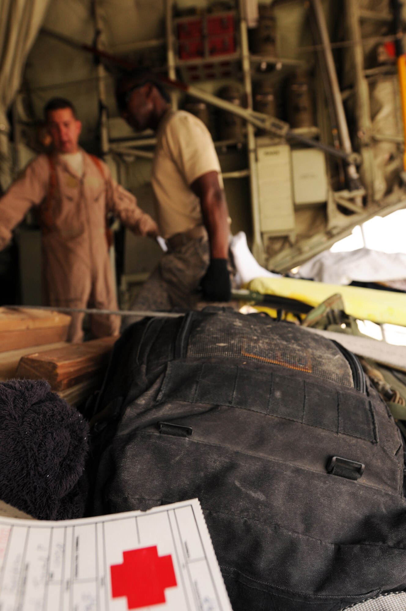 The 455th Expeditionary Aeromedical Evacuation Flight loads patients onto a C-130 Hercules for transport to Bagram Airfield, Afghanistan, June 28, 2011. (U.S. Air Force photo by Senior Airman Krista Rose)