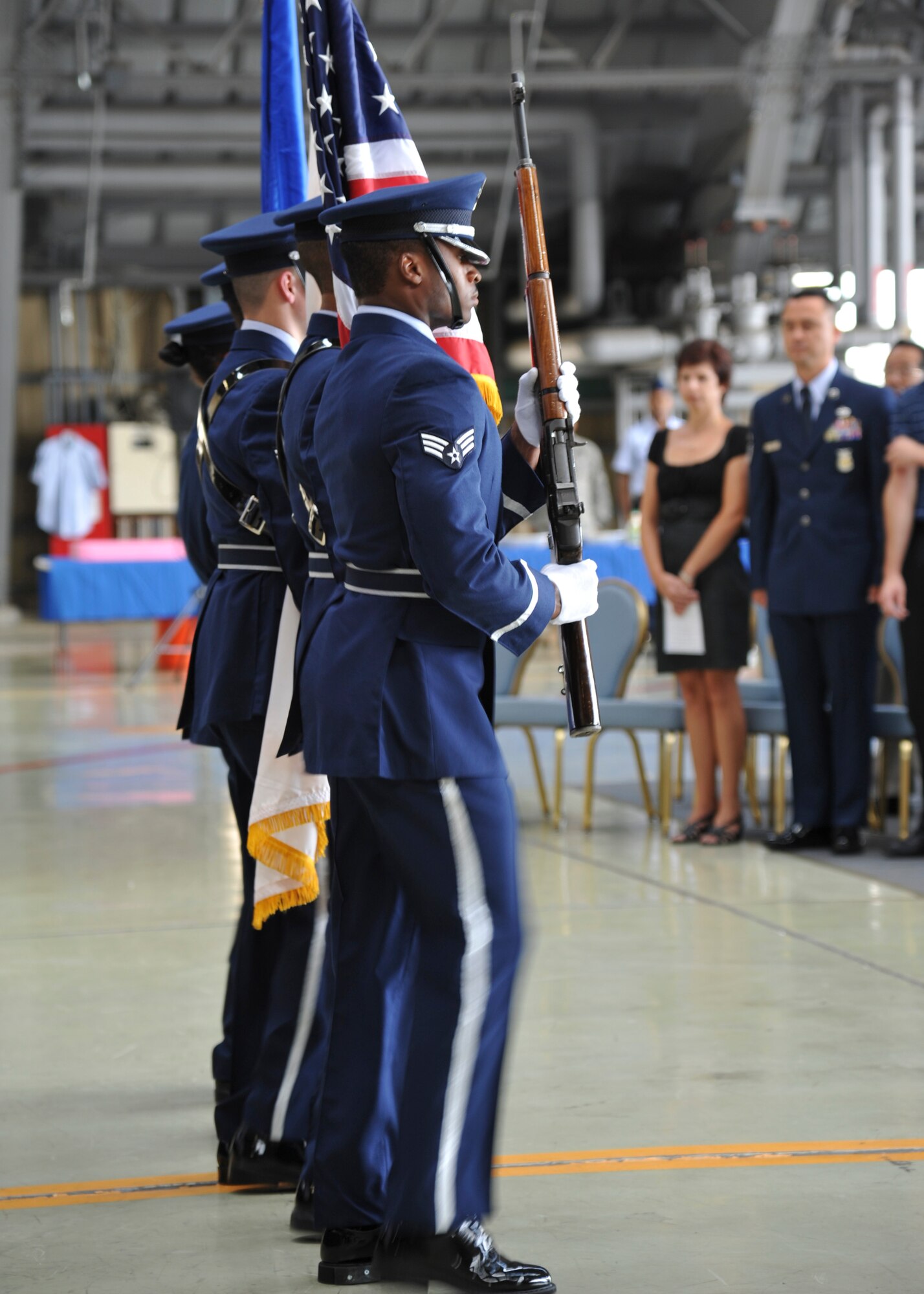 YOKOTA AIR BASE, Japan -- Honor guardsmen from the Yokota Air Base Honor Guard carry the U.S., Japanese and Air Force flags during the 374th Aircraft Maintenance Squadron change of command ceremony at Yokota Air Base, Japan, June 28, 2011. (U.S. Air Force photo/Senior Airman Andrea Salazar)