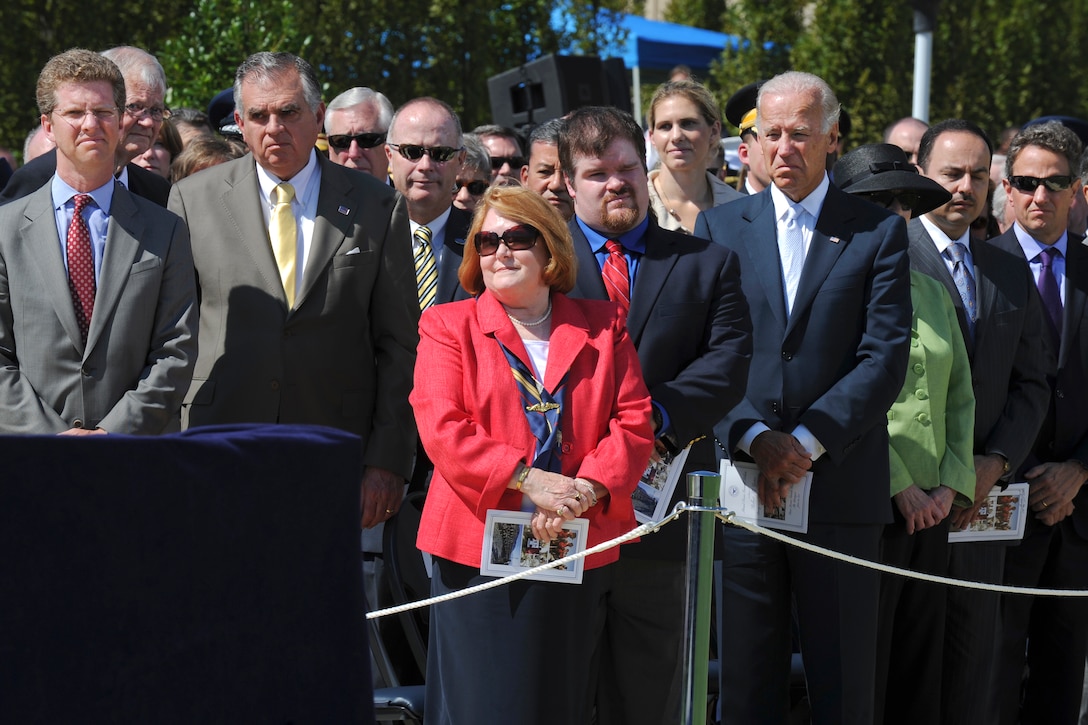 Becky Gates, center, wife of Defense Secretary Robert M. Gates, and their son, Bradley, stand as President Barack Obama presents Gates with the Presidential Medal of Freedom. the highest civilian award a president can bestow, during the  Armed Forces Farewell Tribute to honor Gates at the Pentagon, June 30, 2011.