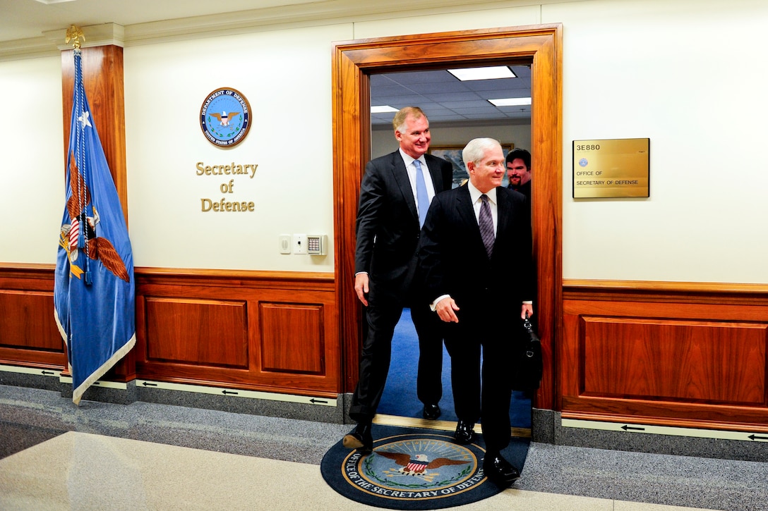Defense Secretary Robert M. Gates and Deputy Defense Secretary William J. Lynn III leave Gates' office for a final time together at the Pentagon, June 30, 2011.
