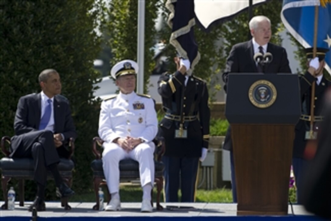 President Barack Obama and Chairman of the Joint Chiefs of Staff Adm. Mike Mullen listen as Secretary of Defense Robert M. Gates addresses audience members at the Armed Forces Farewell Tribute in his honor at the Pentagon on June 30, 2011.  