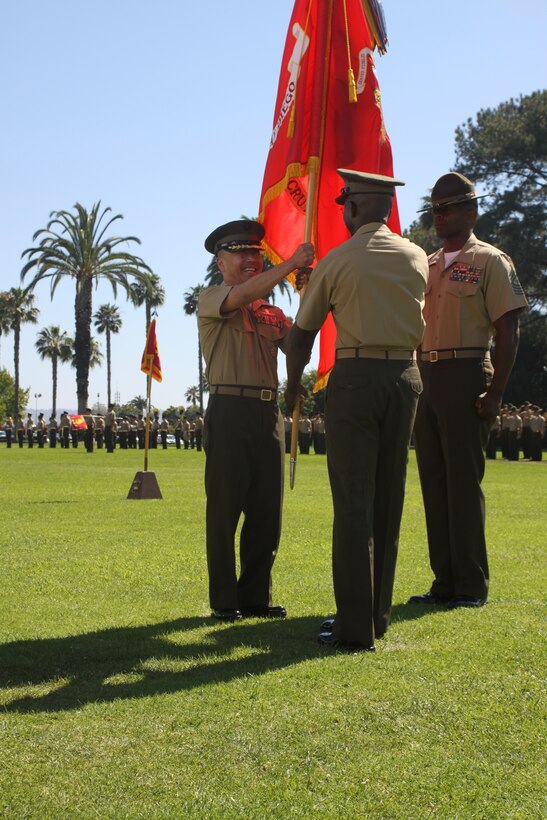 The Marine Corps Mounted Color Guard from Marine Corps Logistics Base Barstow presents the National Colors during the opening ceremony at the Cody Rodeo Stampede in Cody, Wyo., June 30. During the Professional Rodeo Cowboys Association sponsored rodeo the MCG represented the Marine Corps each night by participating in the opening ceremonies.