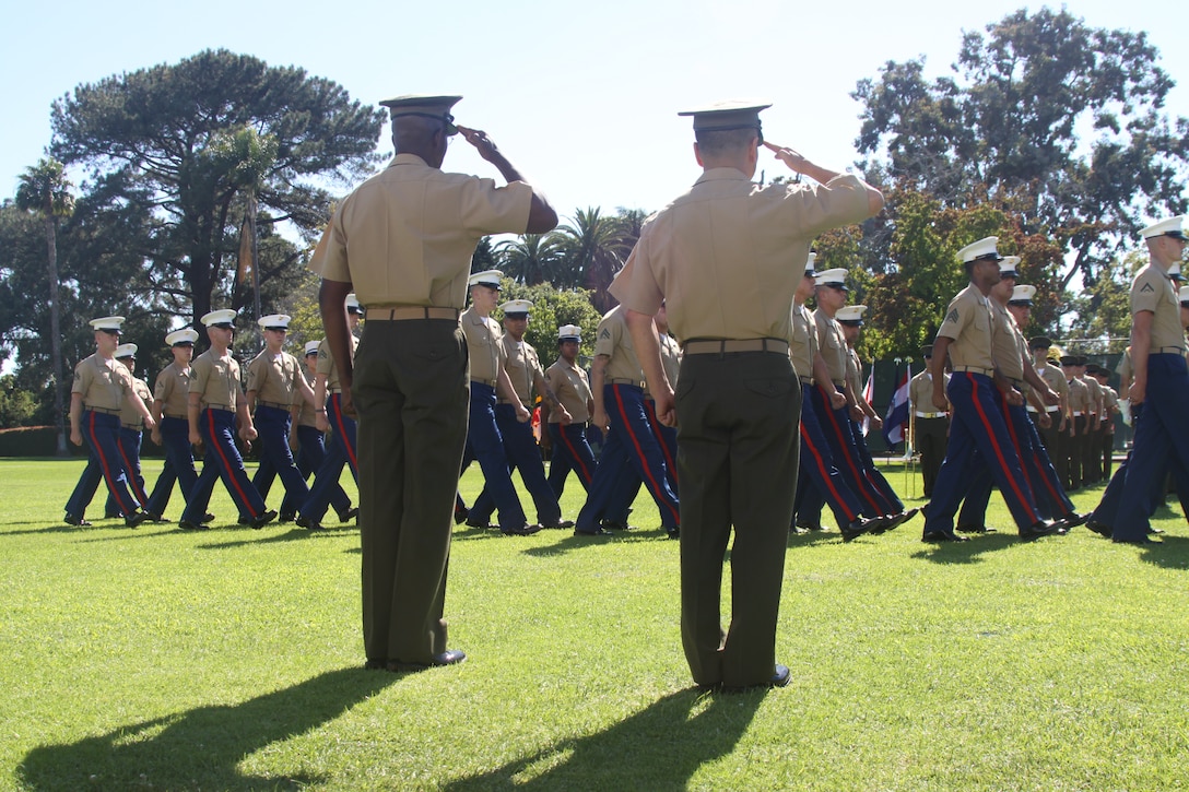 Marine Corps Recruit Depot San Diego and the Western Recruiting Region bid farewell to its commanding general, Maj. Gen. Ronald L. Bailey, former commanging general for Marine Corps Recruit Depot San Diego and the Western Recruiting Region, and Brig. Gen. Daniel D. Yoo, new commanding general for MCRD San Diego, salute as the colors pass during a change of command ceremony on the commanding general’s lawn, June 30.