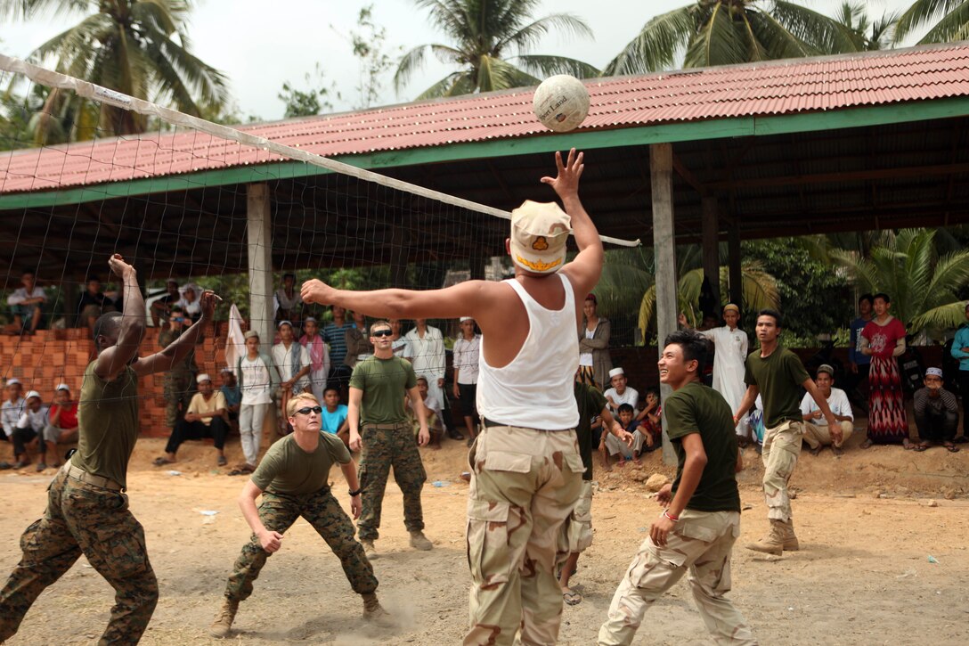 Service members with the Royal Cambodian Navy and the 31st Marine Expeditionary Unit, play a friendly game of volleyball after a medical civil action project, March 1. Marines and Sailors of the 31st MEU worked alongside the Royal Cambodian Navy and the Cambodian Children’s Surgical Center during the MEDCAP. The MEDCAP is a three-day event in support of the Cambodian Maritime Exercise 2011. The Cambodian MAREX ‘11 is part of the U.S. Pacific Command’s Theater Security Cooperation Program, and provides unique and dynamic opportunities for collaboration between the Cambodian and U.S. military, while promoting relationship-building between militaries and local communities.