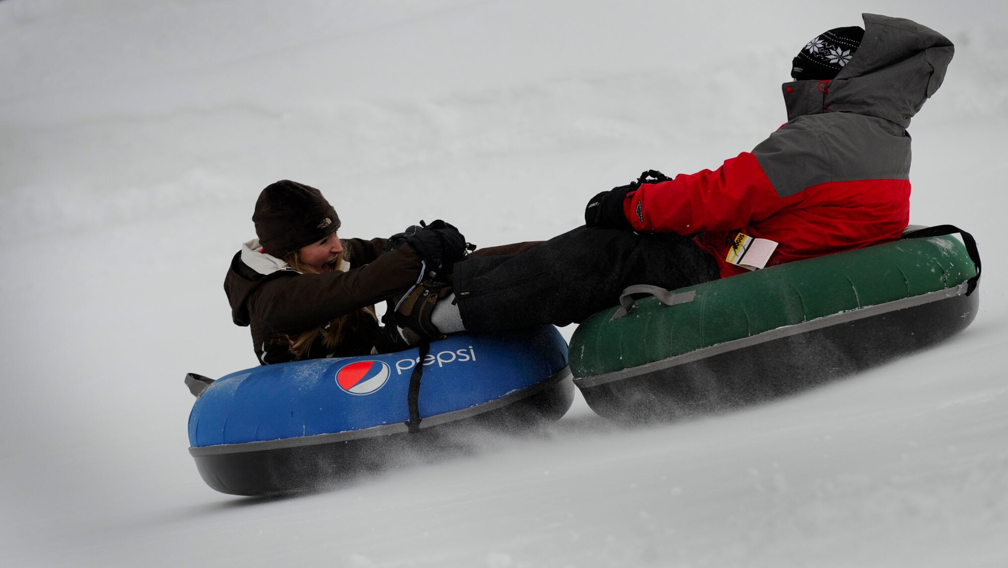 BOISE, Idaho –Bogus Basin Recreation Area patrons perform a “helicopter” while tubing during the Gunfighter’s 2011 Winter Sports Day Feb. 25. Tubing was one of several activities members of the 366th Fighter Wing took advantage of during the day. (U.S. Air Force photo by Airman 1st Class Renishia Richardson)