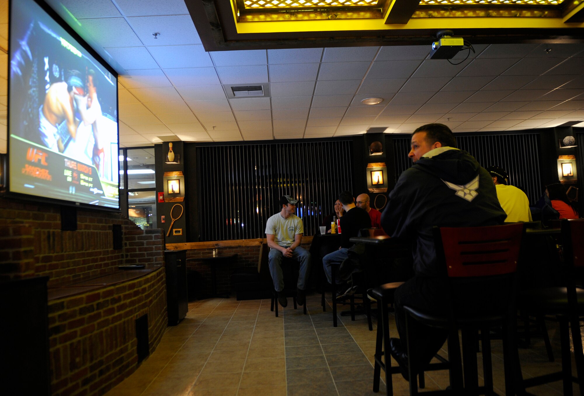 MOUNTAIN HOME AIR FORCE BASE, Idaho – Gunfighters gather at the bowling center’s newly remodeled Strikers Grill to watch an Ultimate Fighting Championship Feb. 26. The grill underwent three and a half months of renovation, a project that cost more than $200,000. (U.S. Air Force photo by Airman 1st Class Renishia Richardson)