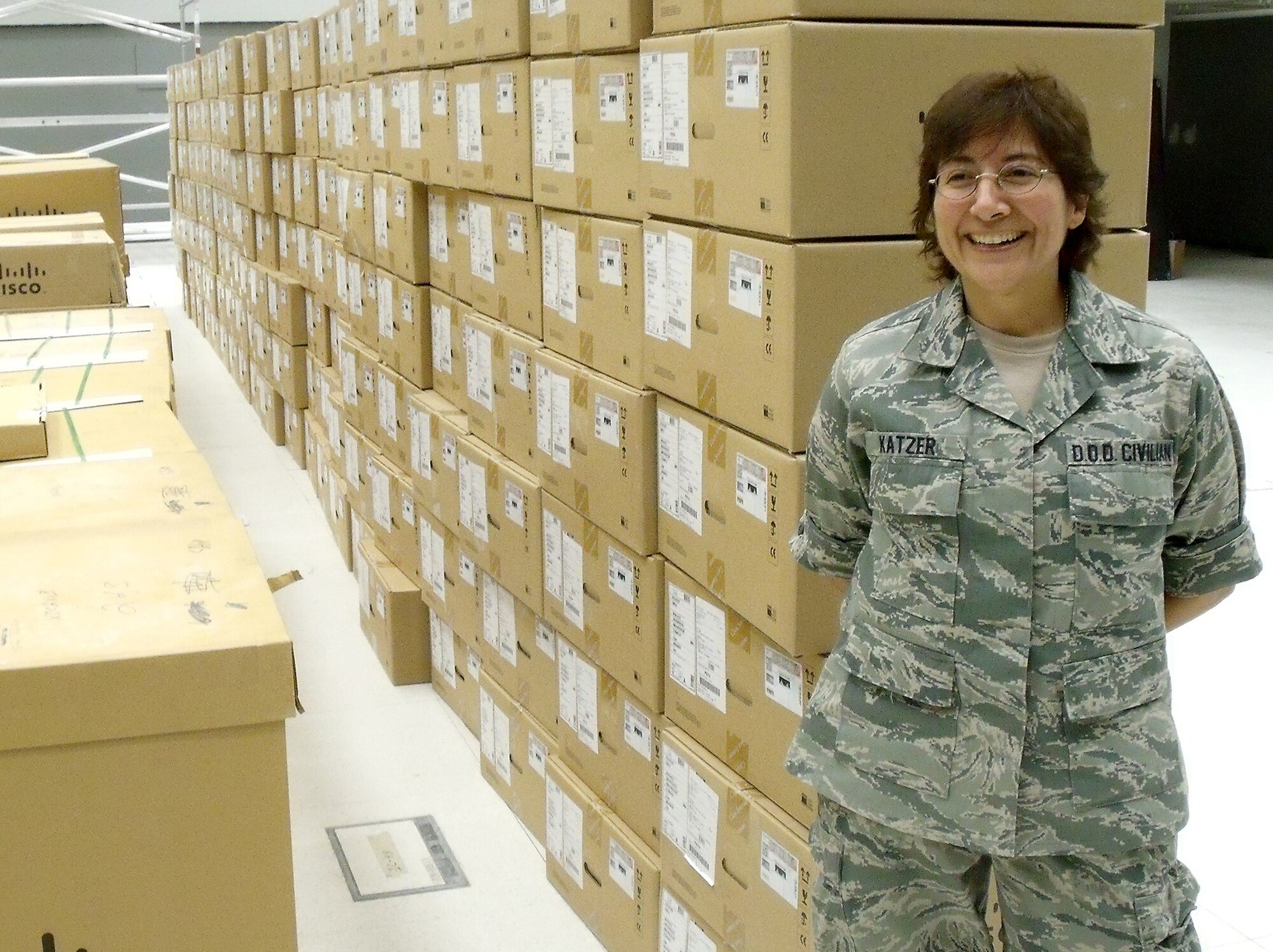 Pat Katzer, show here during a deployment in 2009, recently provided network engineering to establish a more robust communications infrastructure in support of the Global Hawk mission at Grand Forks Air Force Base, N.D.  Ms. Katzer is a network systems engineer at the Air Force Network Integration Center at Scott AFB, Ill., and specializes in command and control intelligence, surveillance and reconnaissance telecommunications engineering.   (Courtesy photo)
