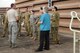 Members of the Royal Australian Air Force (RAAF) Base, Williamtown, Australia medical group work with Chief Master Sgt. Ed Chandler (left) and members of the 132nd Fighter Wing (132FW), Des Moines, Iowa Medical Group during an orientation to the 132FW F-16 aircraft during joint flying operation, 