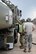 LAC Greg McMahon (left), from the Royal Australian Air Force (RAAF) Base, Williamtown, Australia, works with Senior Master Sgt. Mark Low (right), from the 132nd Fighter Wing (132FW), Des Moines, Iowa, to de-fuel an F-16 aircraft on the flight line of the RAAF Williamtown on March 1, 2011.  The 132FW is currently deployed in Australia, working with the RAAF for joint flying mission, 