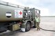 LAC Greg McMahon (left), from the Royal Australian Air Force (RAAF) Base, Williamtown, Australia, works on the flight line of the RAAF Williamtown to de-fuel an F-16 aircraft from the 132nd Fighter Wing (132FW), Des Moines, Iowa on March 1, 2011.  The 132FW and RAAF are currently engaged in Dissimilar Air Combat Training mission, 