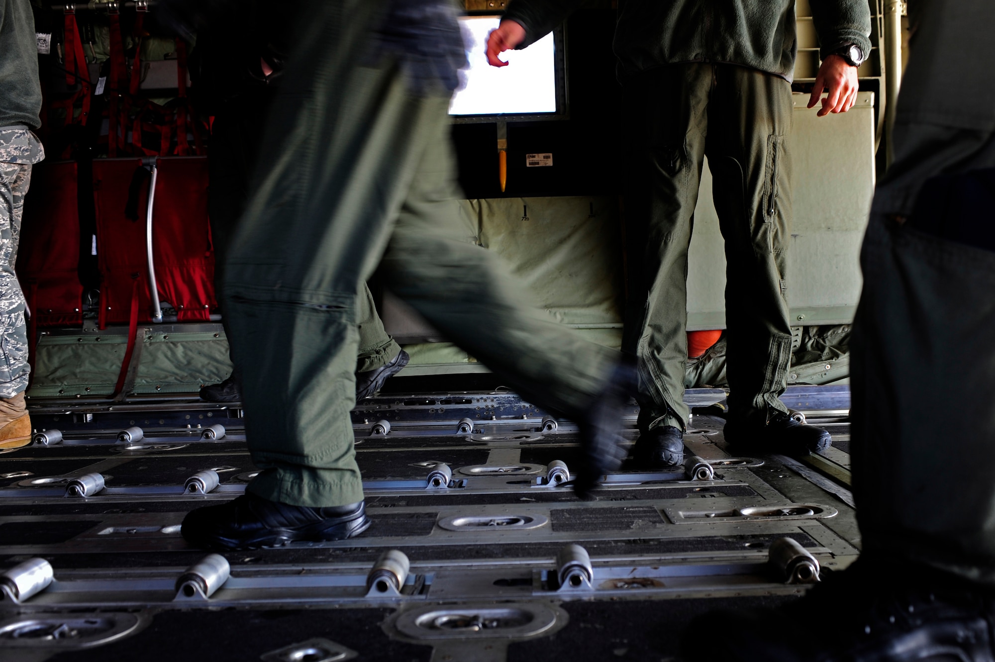 U.S. Air Force loadmasters from the Air Force Special Operations Training Center push a pallet onto an EC-130J for a training sortie Feb. 10, 2011, Harrisburg International Airport, Pa. The students of class 1101 must complete core tasks to complete mission qualification training on the EC-130J. (U.S. Air Force photo by Staff Sgt. Julianne M. Showalter/Released)