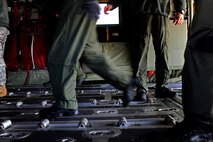 U.S. Air Force loadmasters from the Air Force Special Operations Training Center push a pallet onto an EC-130J for a training sortie Feb. 10, 2011, Harrisburg International Airport, Pa. The students of class 1101 must complete core tasks to complete mission qualification training on the EC-130J. (U.S. Air Force photo by Staff Sgt. Julianne M. Showalter/Released)