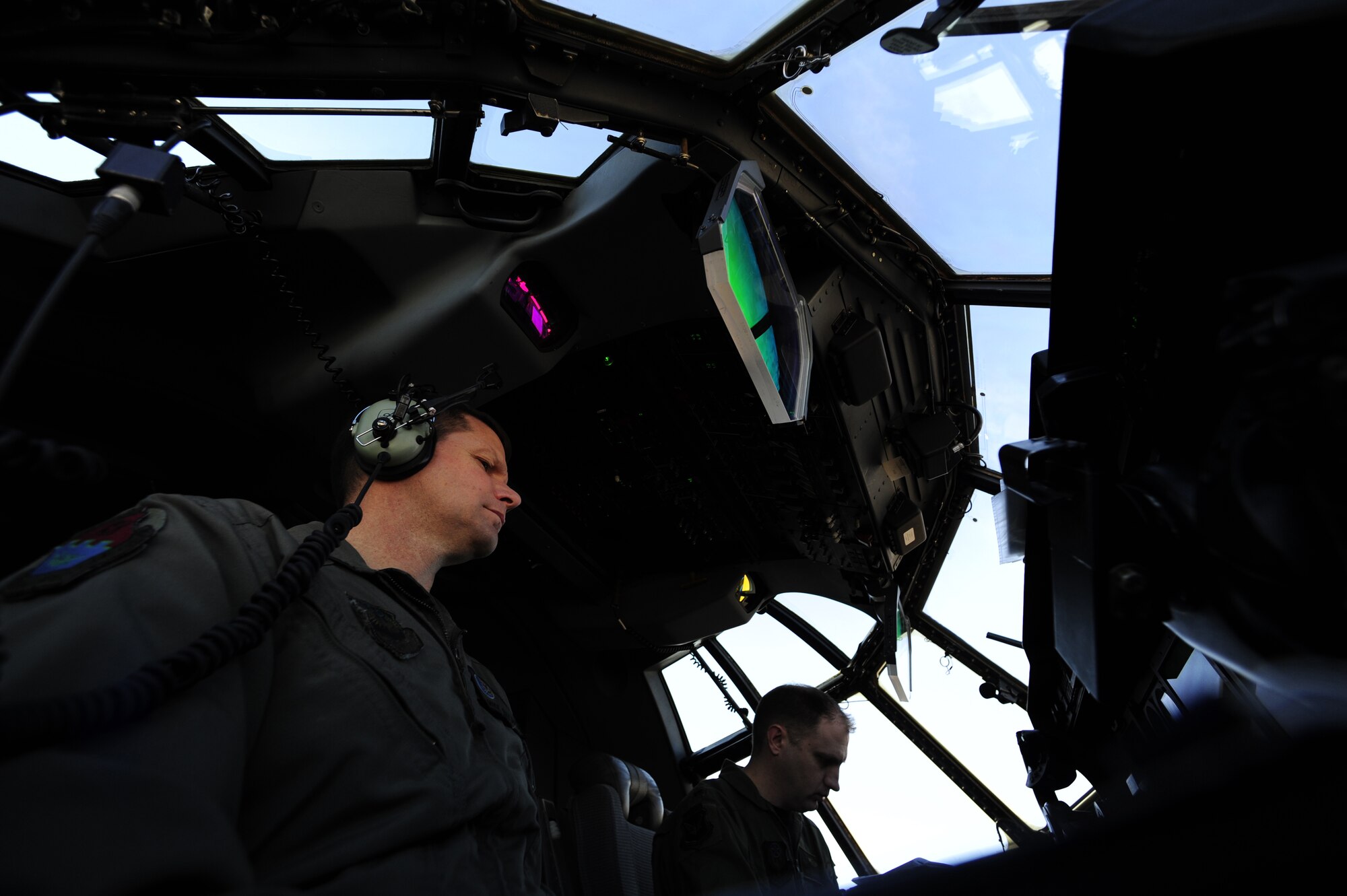 U.S. Air Force Lt. Col. Michael Watson and Maj. Andrew Jennings, Air Force Special Operations Training Center student pilots class 1101, go through a startup check list on an EC-130J Feb. 11, 2011, Harrisburg International Airport, Pa. Class 1101 is the first group of students to attend mission qualification training for the EC-130 J that will replace all the E- and P-model aircraft within the next few years. The EC-130J is equipped with modern avionics, mission systems and a more capable and sustainable airframe that will provide specialized mobility to combatant commanders. (U.S. Air Force photo by Staff Sgt. Julianne M. Showalter/Released)