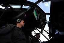 U.S. Air Force Lt. Col. Michael Watson and Maj. Andrew Jennings, Air Force Special Operations Training Center student pilots class 1101, go through a startup check list on an EC-130J Feb. 11, 2011, Harrisburg International Airport, Pa. Class 1101 is the first group of students to attend mission qualification training for the EC-130 J that will replace all the E- and P-model aircraft within the next few years. The EC-130J is equipped with modern avionics, mission systems and a more capable and sustainable airframe that will provide specialized mobility to combatant commanders. (U.S. Air Force photo by Staff Sgt. Julianne M. Showalter/Released)